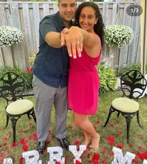 Newly engaged couple showing a diamond ring