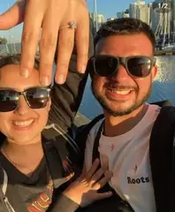 Couple showing an engagement ring