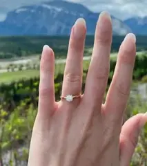 Diamond engagement ring worn on the hand